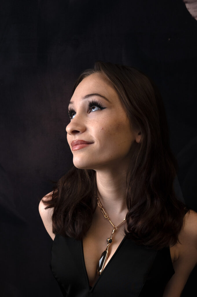 Teen girl smiling and looking upward
