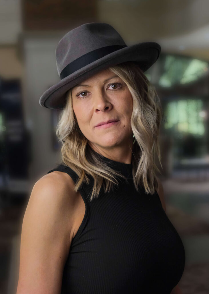 Young woman wearing gray fedora hat